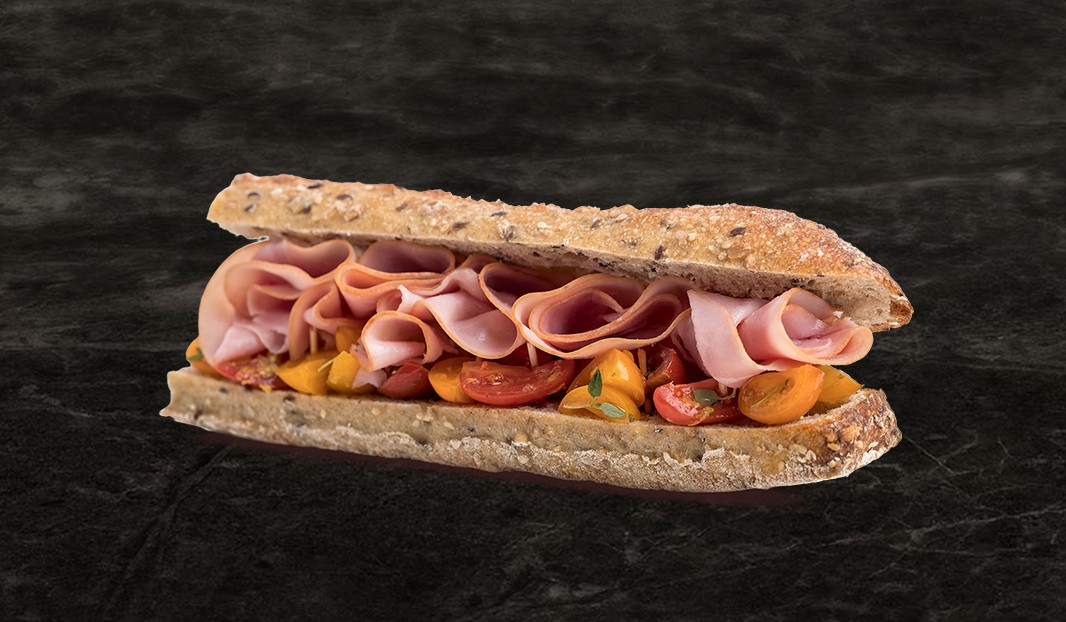 Ham and marinated tomato baguette