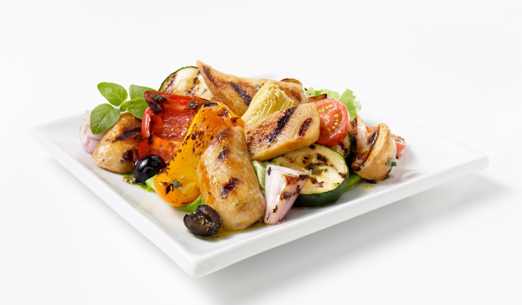 Warm salad with sausages, grilled vegetables and artichokes